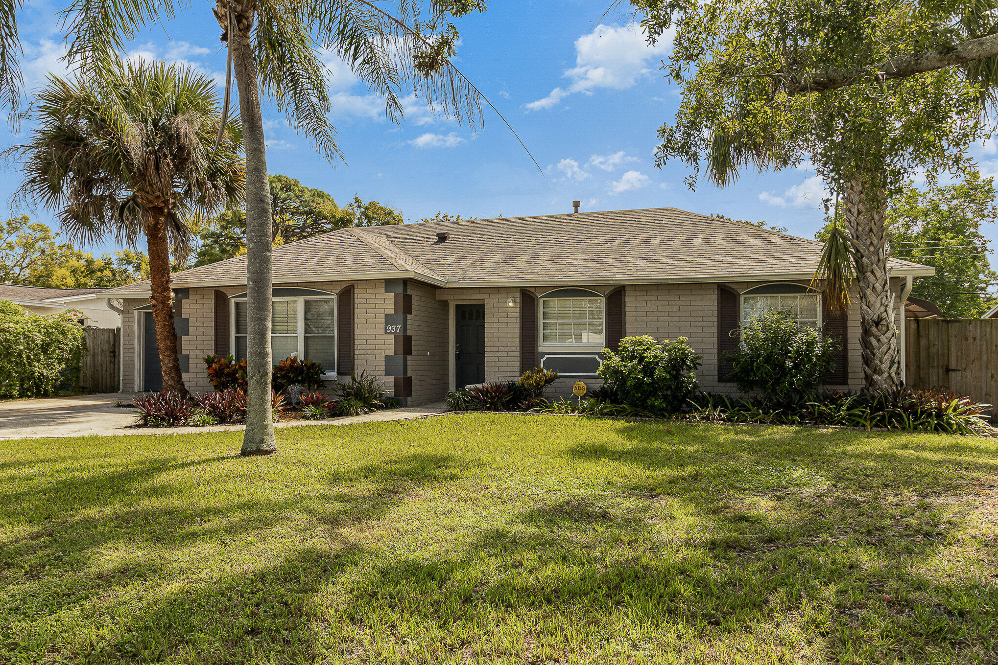 937 Kings Post Road Rockledge, FL 32955 - Photo 8 of 24 a front view of a house with a yard
