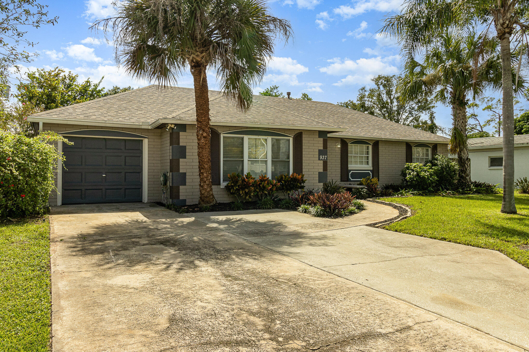 937 Kings Post Road Rockledge, FL 32955 - Photo 9 of 24 a view of a house with palm trees