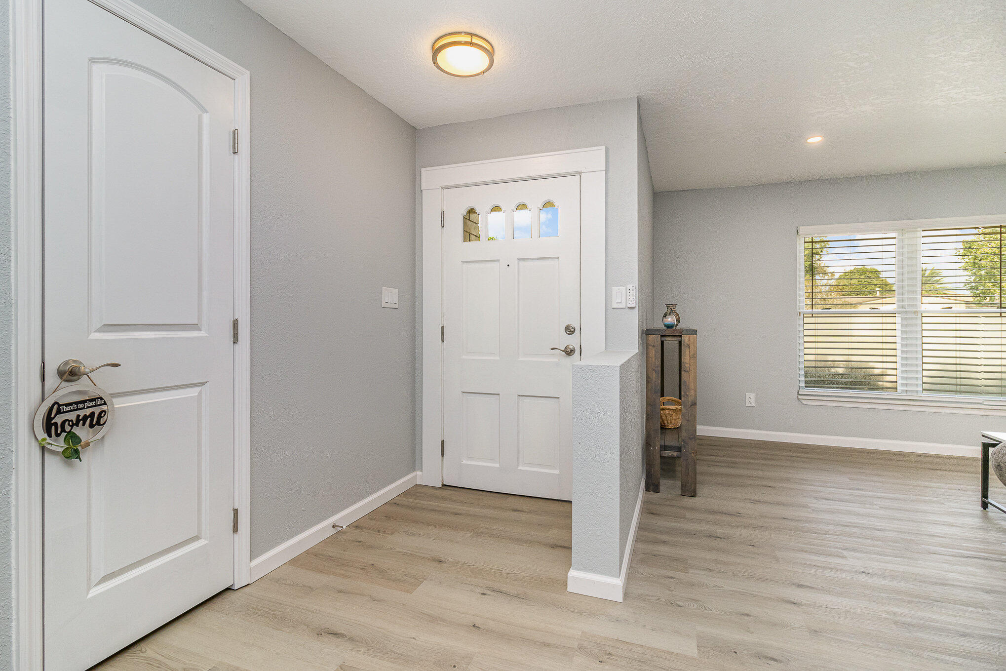 937 Kings Post Road Rockledge, FL 32955 - Photo 10 of 24 an empty room with wooden floor and a window