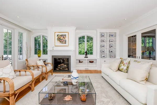 a living room with furniture and a fireplace