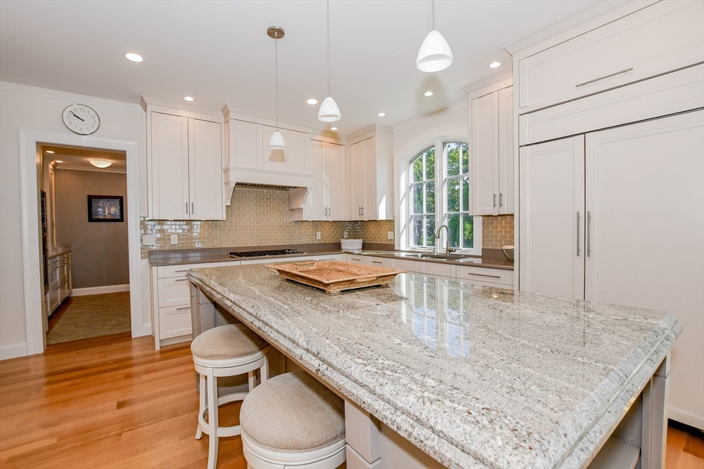 85 Moorings Road Marion, MA 02738 - Photo 17 of 37 a kitchen with granite countertop kitchen island a table and chairs in it