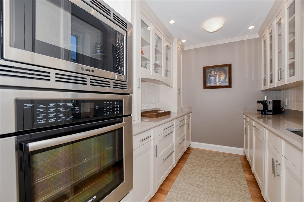 85 Moorings Road Marion, MA 02738 - Photo 19 of 41 a kitchen with stainless steel appliances granite countertop a stove and a microwave