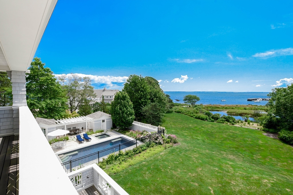 85 Moorings Road Marion, MA 02738 - Photo 2 of 37 a view of backyard with plants and outdoor seating