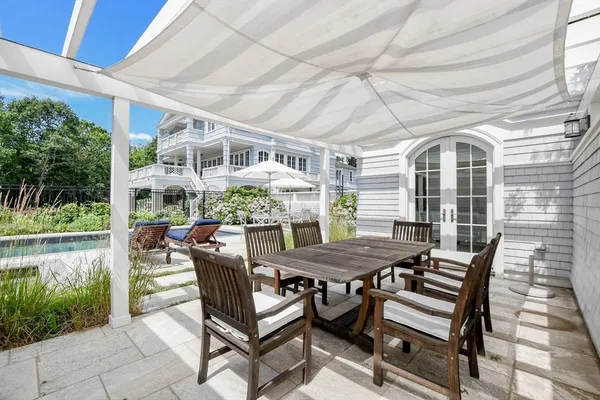 a view of a patio with a table and chairs