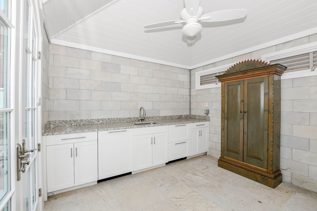 85 Moorings Road Marion, MA 02738 - Photo 29 of 37 a bathroom with a granite countertop sink a toilet and shower
