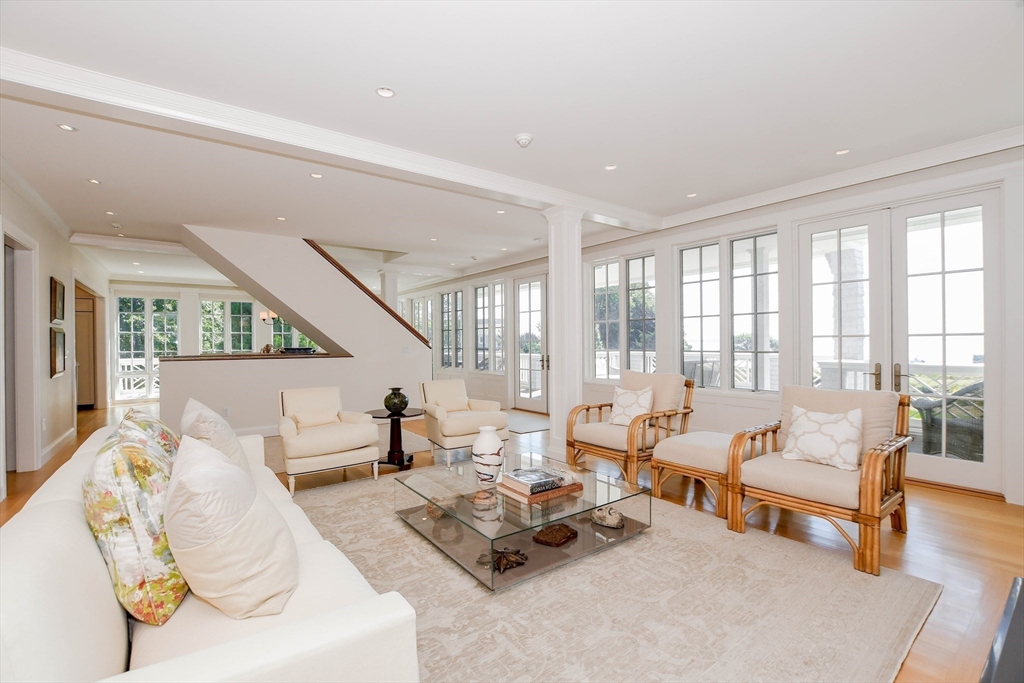 85 Moorings Road Marion, MA 02738 - Photo 4 of 37 a living room with furniture and floor to ceiling windows