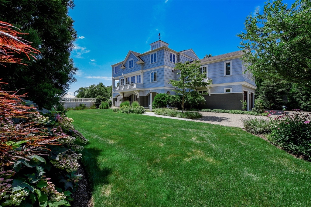 85 Moorings Road Marion, MA 02738 - Photo 8 of 37 a front view of a house with yard and green space