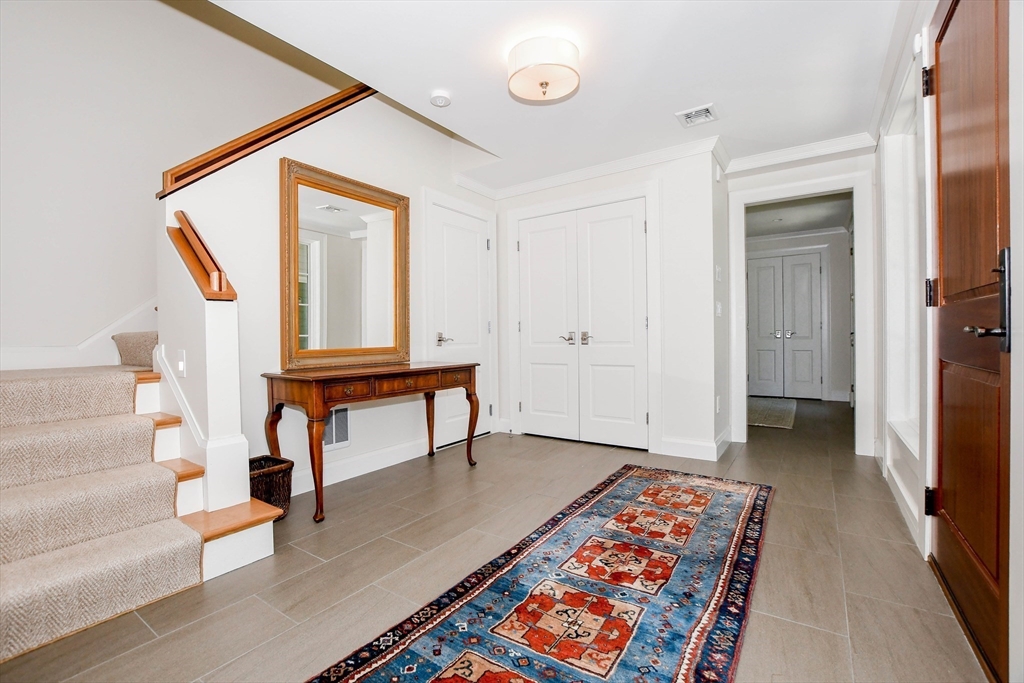 85 Moorings Road Marion, MA 02738 - Photo 10 of 37 a view of entryway and hall with wooden floor
