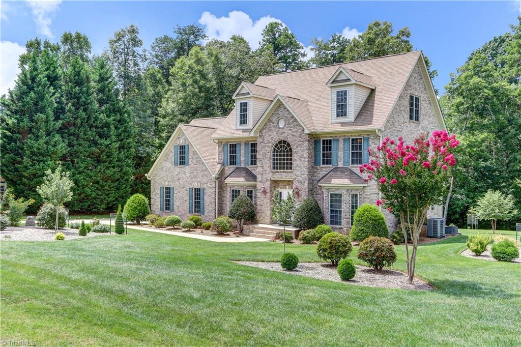 Beautifully landscaped and easily maintained with in ground irrigation system (14 zones and 48 heads).  Extra-long concrete paved parking pad.  Vinyl double hung windows with screens.  New 2nd and 3rd floor HVAC.