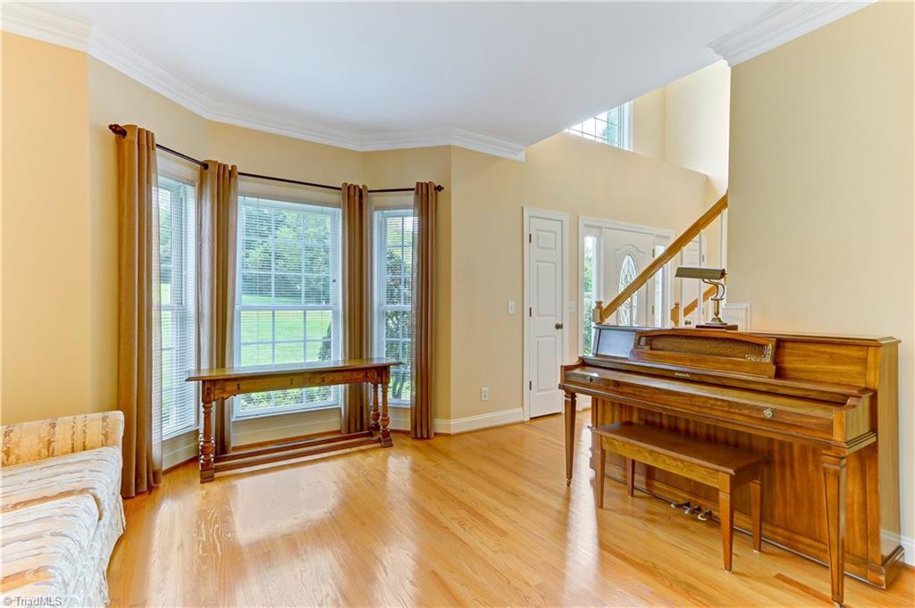 Formal Living Room or potential to be first floor office.  Bay window, base and crown molding.  Oak hardwood flooring continues.