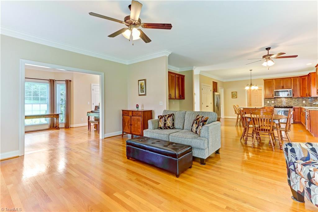 6703 Fegan Road Summerfield, NC 27358 - Photo 30 of 30 Another view of the Great Room showing the open floor plan to the Breakfast room and Kitchen.