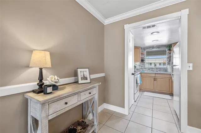 a kitchen with stainless steel appliances white cabinets a window and a sink