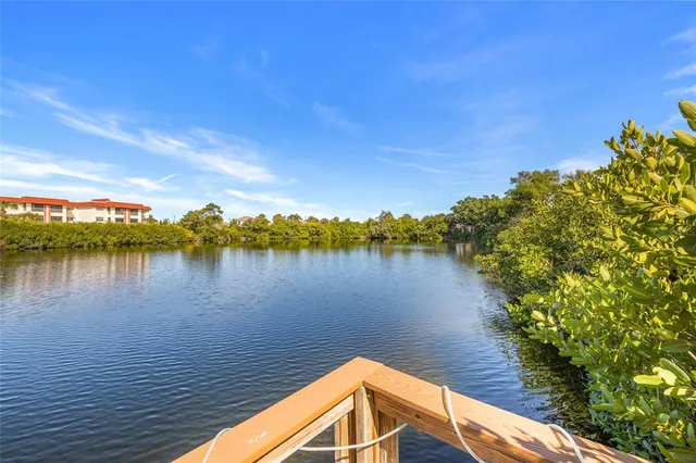a view of a swimming pool with a lake view