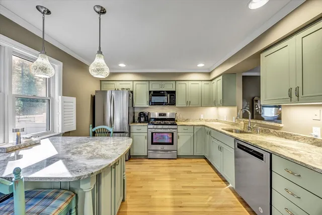a kitchen with a sink and a stove