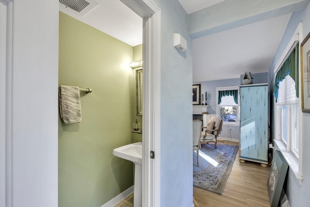 4 Bob White Crescent, Unit 4 Mashpee, MA 02649 - Photo 14 of 37 a view of a hallway with wooden floor and a living room