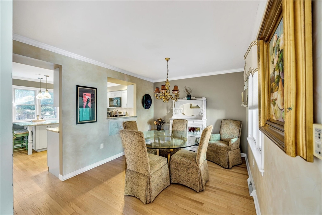 4 Bob White Crescent, Unit 4 Mashpee, MA 02649 - Photo 15 of 37 a living room with furniture and a chandelier