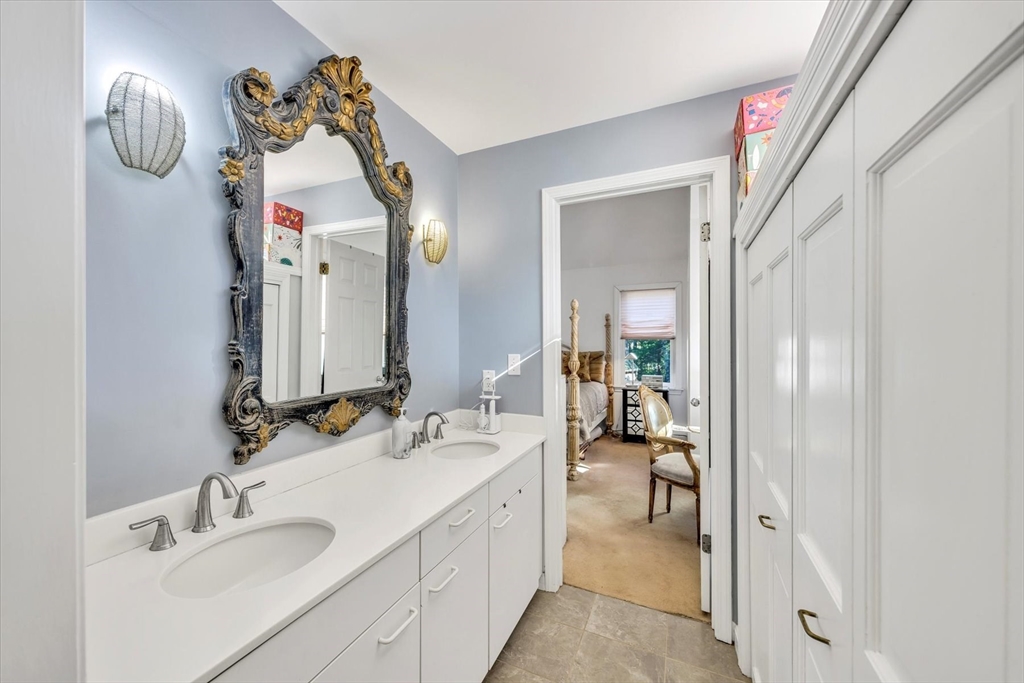 4 Bob White Crescent, Unit 4 Mashpee, MA 02649 - Photo 25 of 37 a en suite bathroom with a sink double vanity and a mirror