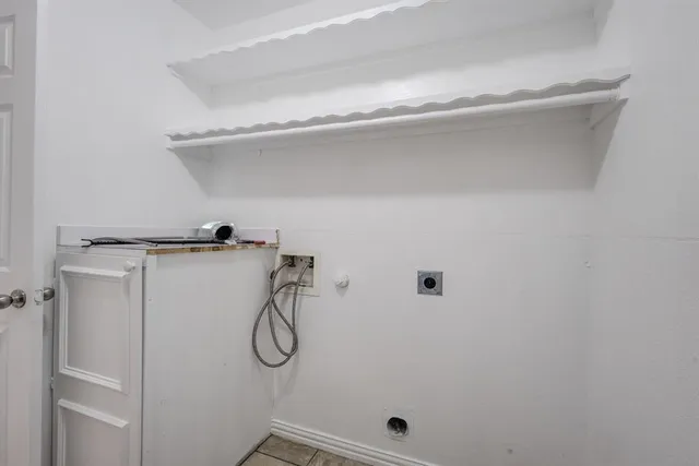 an empty room with windows and entrance