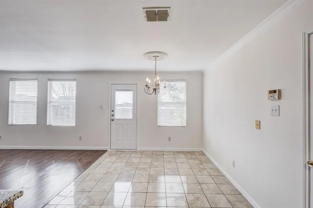 a large kitchen with kitchen island granite countertop a stove and a sink