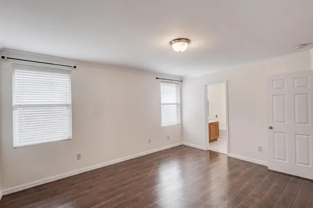 a bathroom with a granite countertop sink a mirror and a bathtub