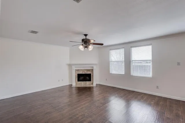 a view of a kitchen with a sink and a refrigerator
