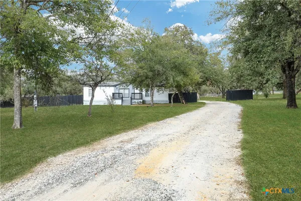 a view of a backyard with a garden