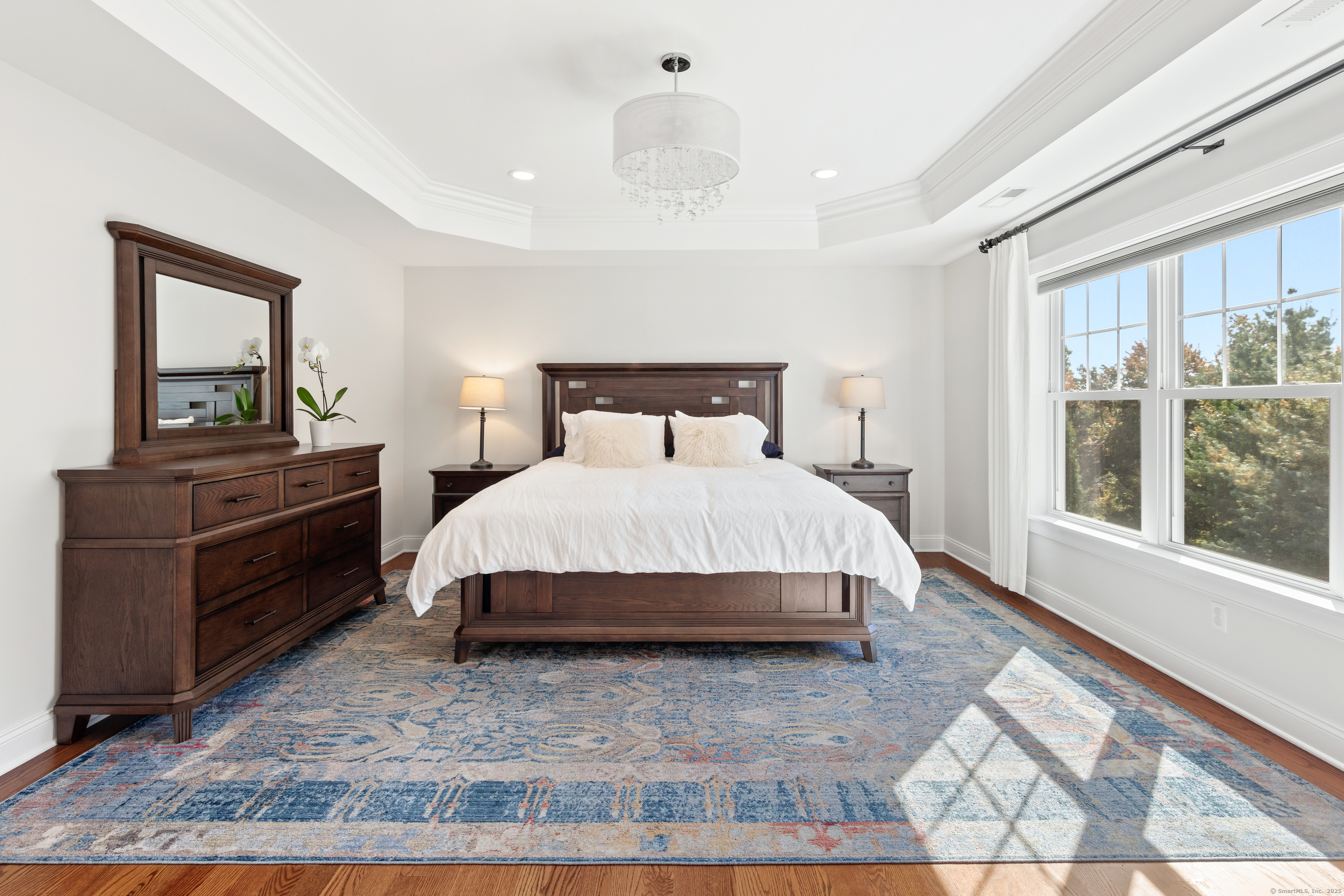 109 Jeniford Road Fairfield, CT 06824 - Photo 17 of 40 a bedroom with a bed and wooden floor