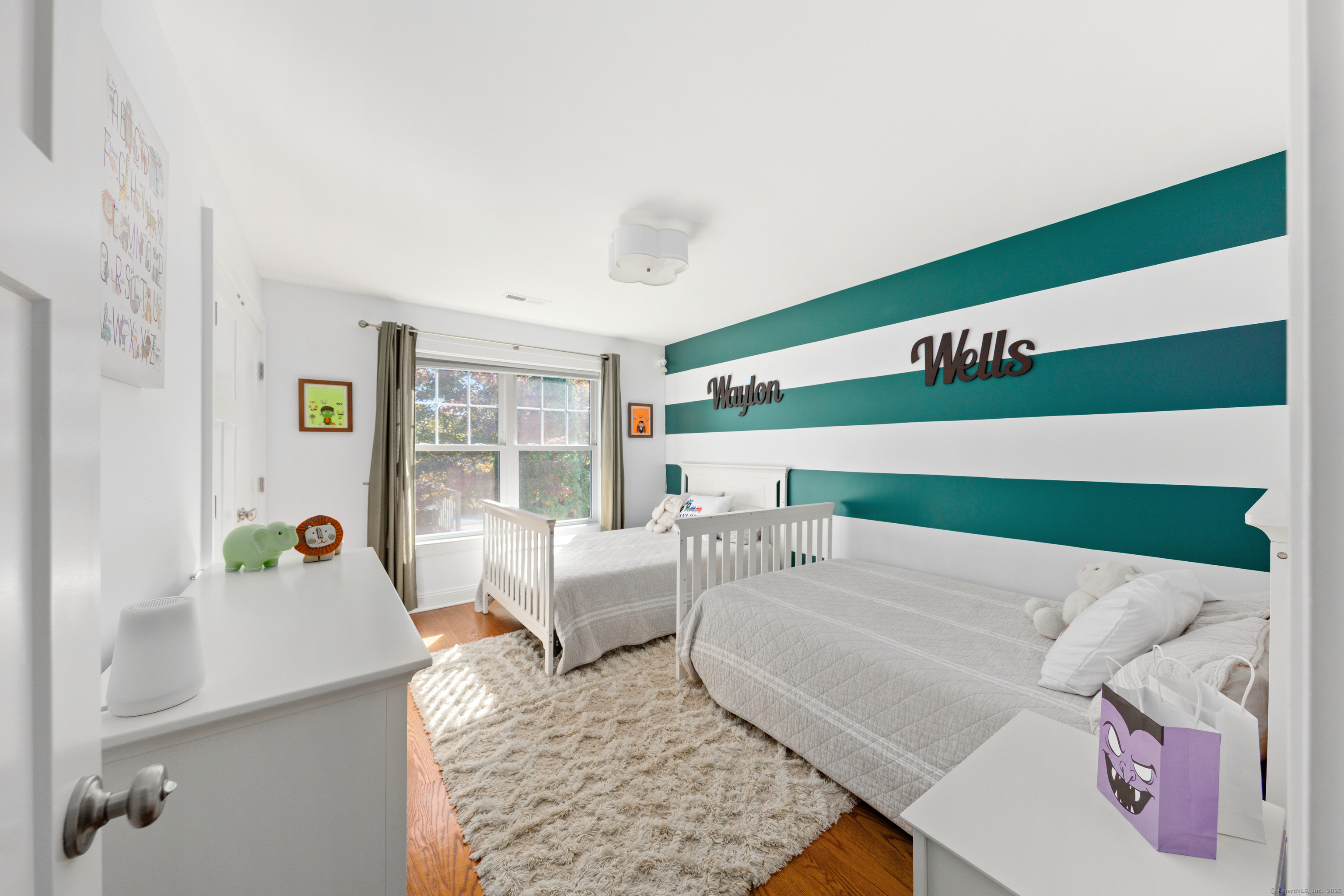 109 Jeniford Road Fairfield, CT 06824 - Photo 22 of 40 a living room with furniture and a rug