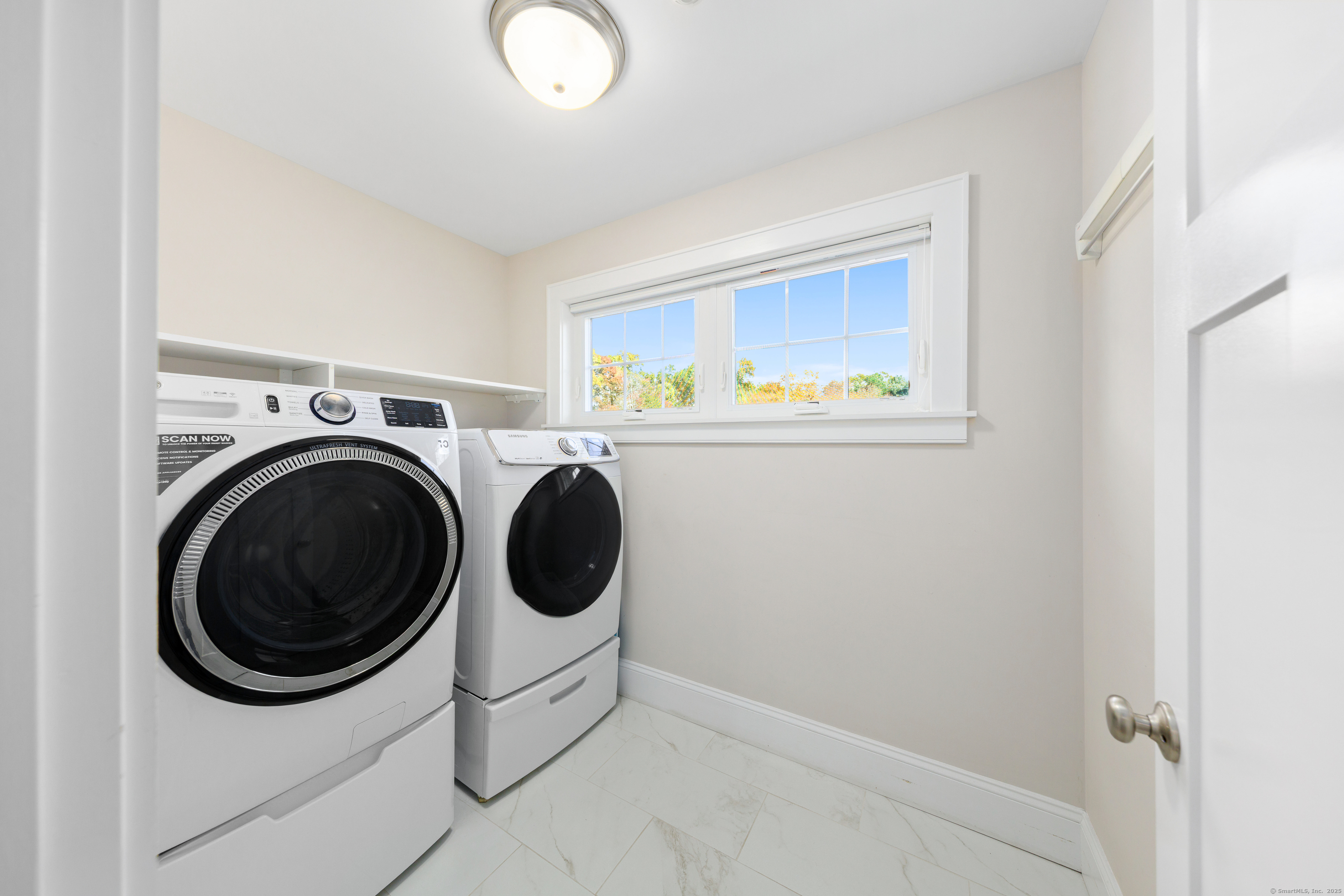 109 Jeniford Road Fairfield, CT 06824 - Photo 24 of 40 a utility room with dryer and washer