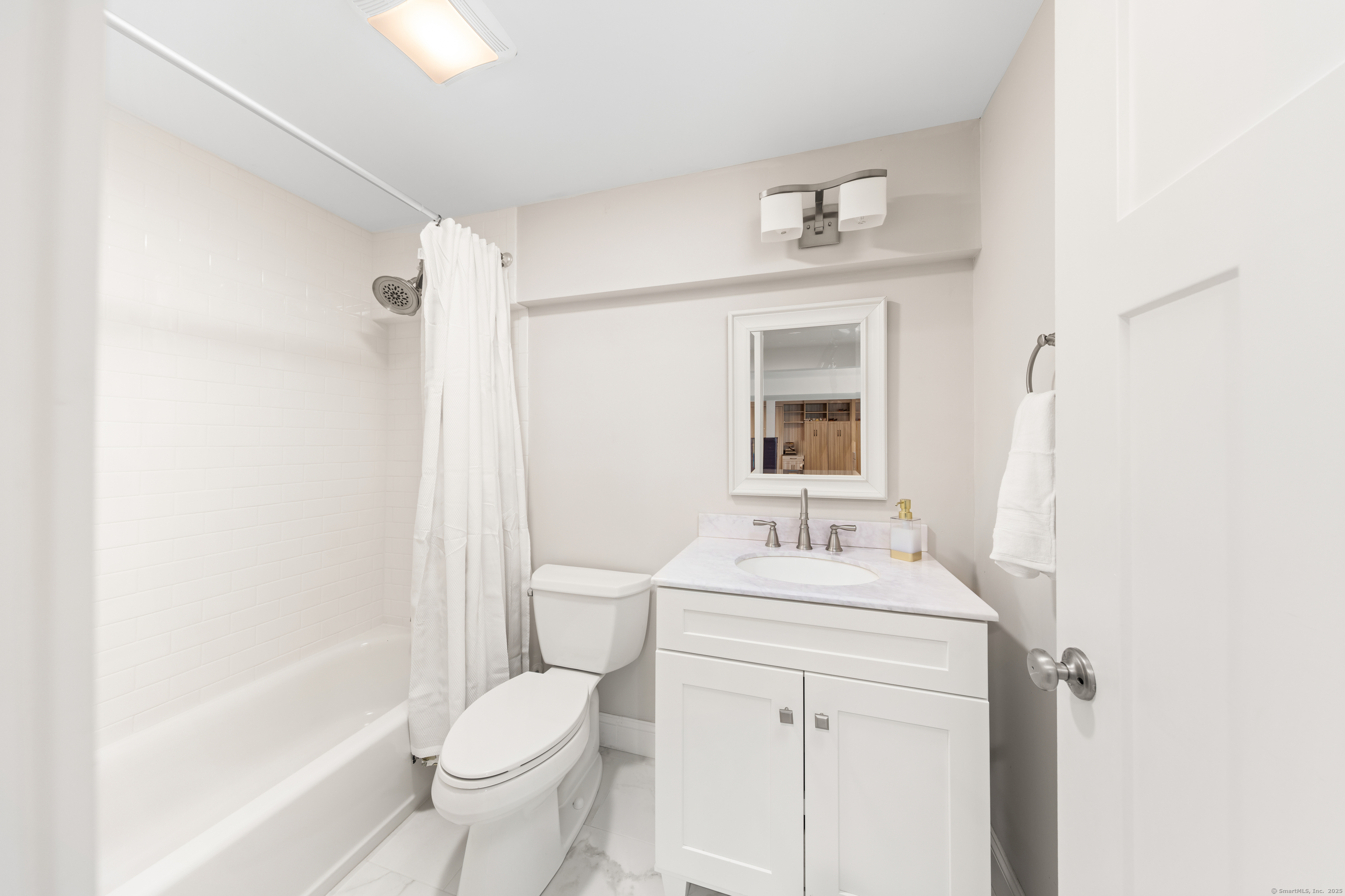 109 Jeniford Road Fairfield, CT 06824 - Photo 28 of 40 a bathroom with a sink toilet vanity and tub