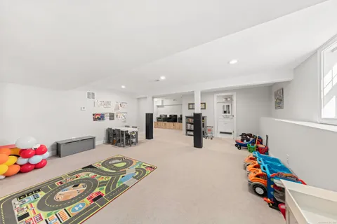 a children room with furniture and a chandelier