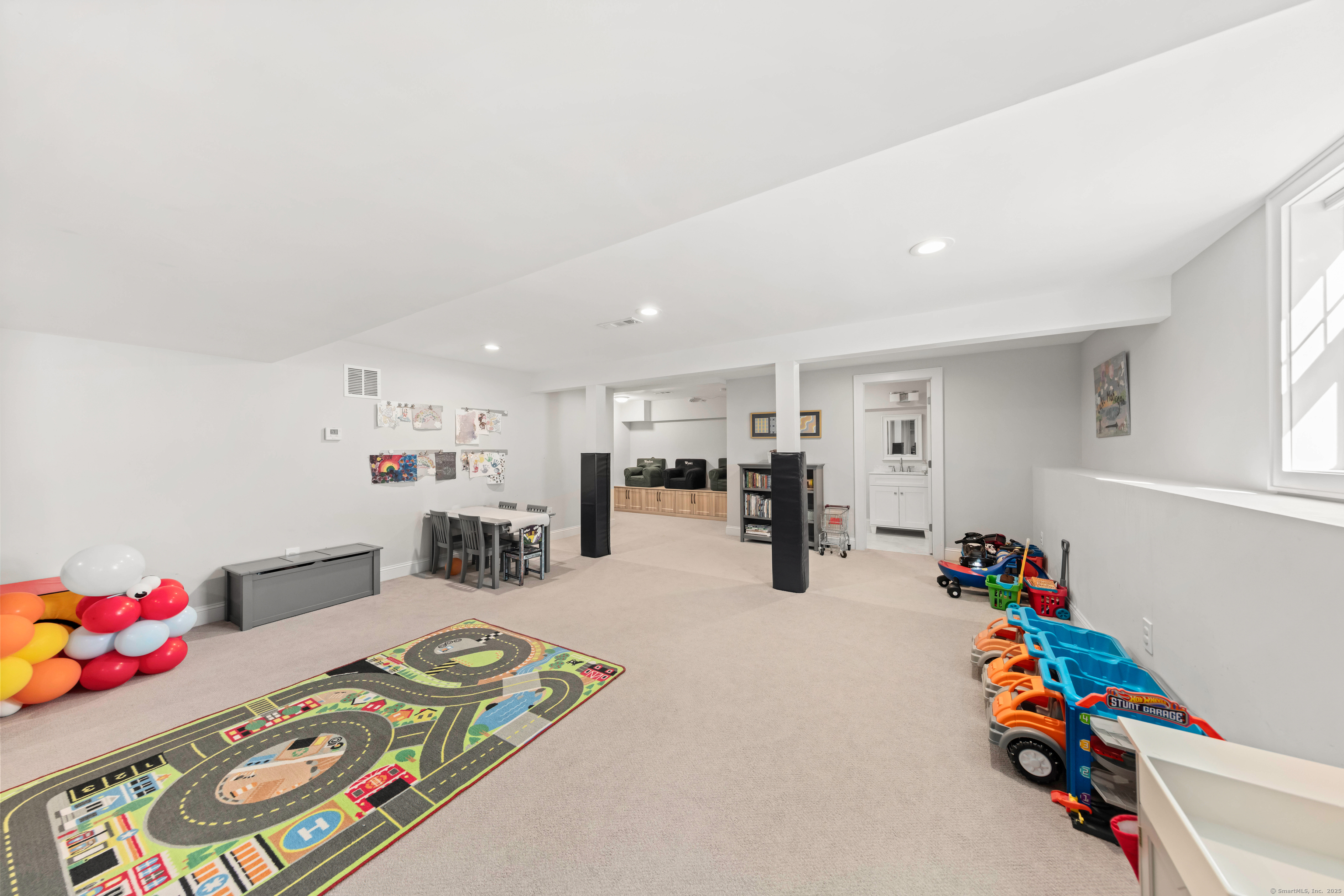 109 Jeniford Road Fairfield, CT 06824 - Photo 29 of 40 a children room with furniture and a chandelier