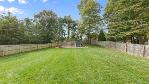 a picture of a bench in front of a wall