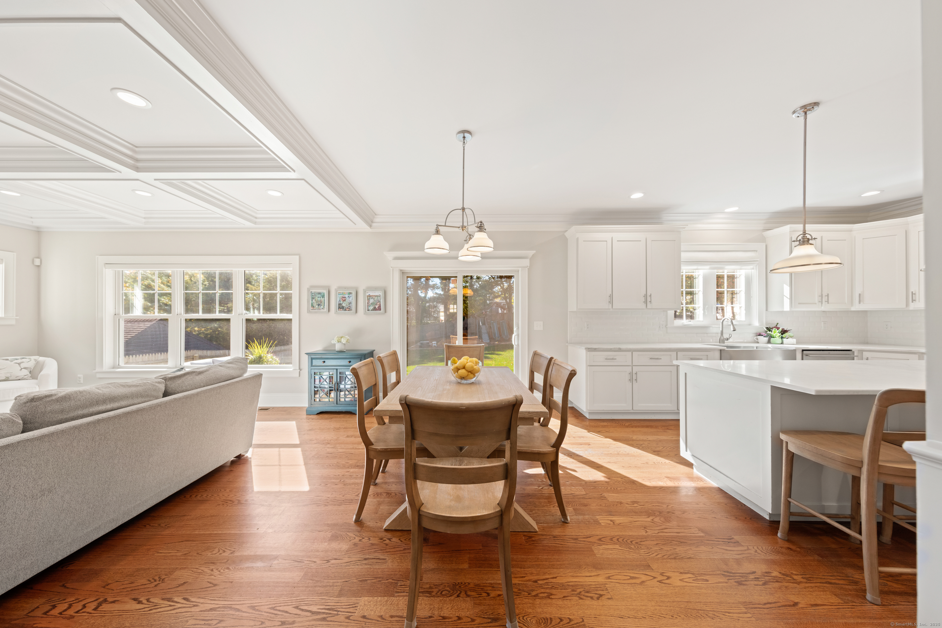 109 Jeniford Road Fairfield, CT 06824 - Photo 8 of 40 a dining room with furniture a chandelier and wooden floor