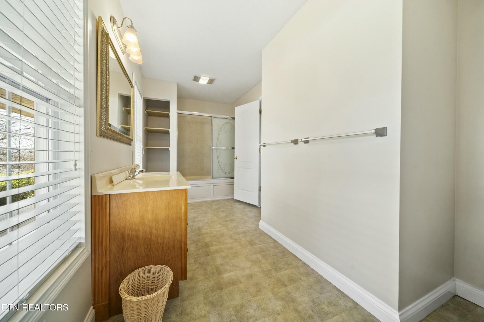 8345 Cliff Ridge Court Corryton, TN 37721 - Photo 21 of 54 a bathroom with a granite countertop sink and a mirror