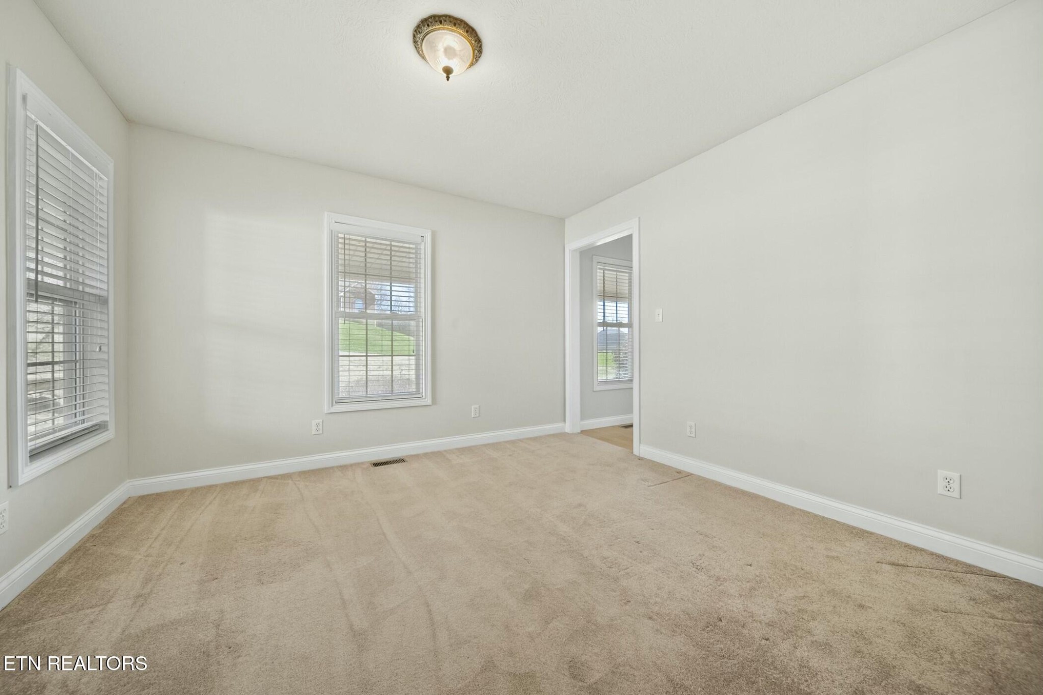 8345 Cliff Ridge Court Corryton, TN 37721 - Photo 24 of 54 an empty room with windows