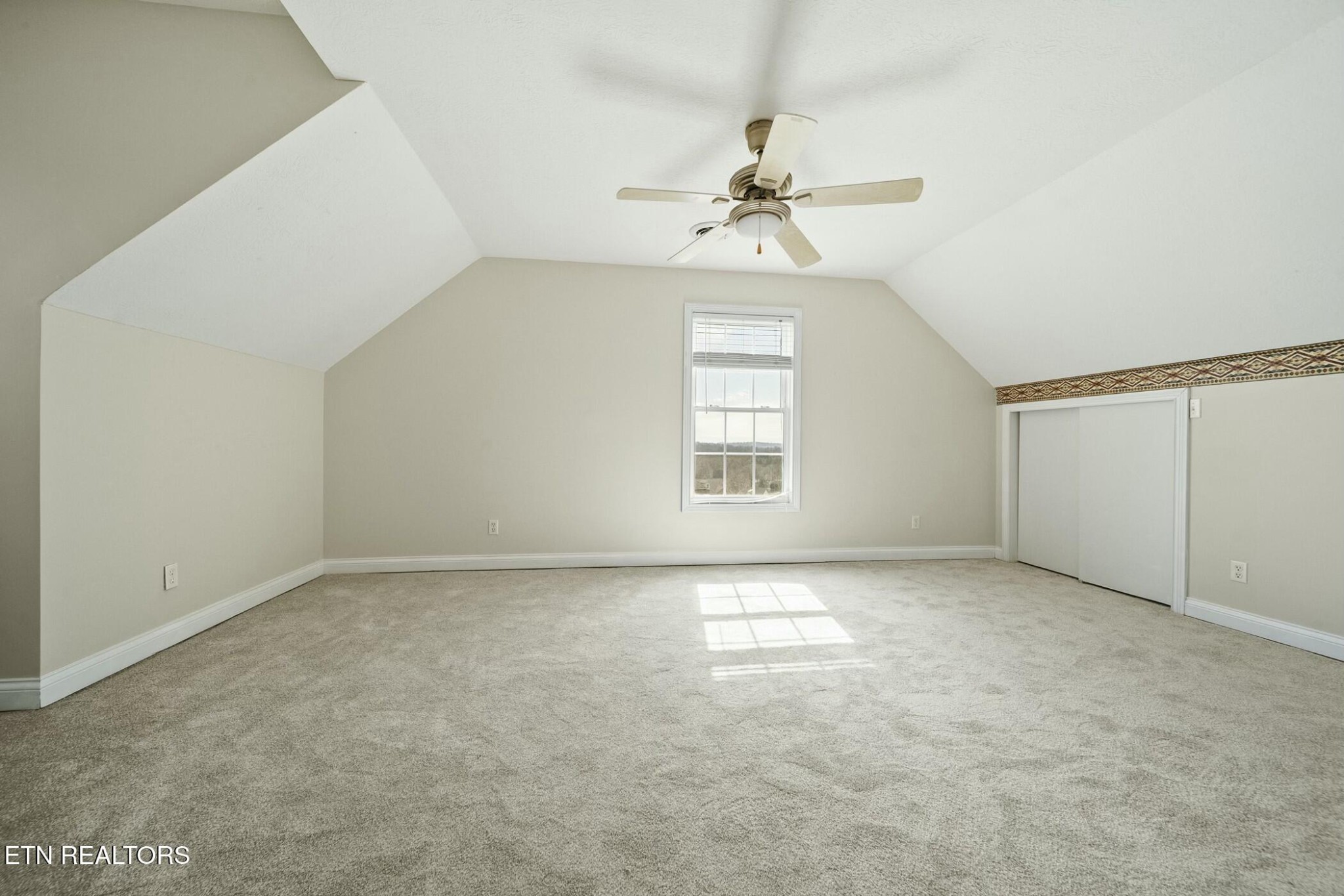8345 Cliff Ridge Court Corryton, TN 37721 - Photo 27 of 54 an empty room with windows and fan