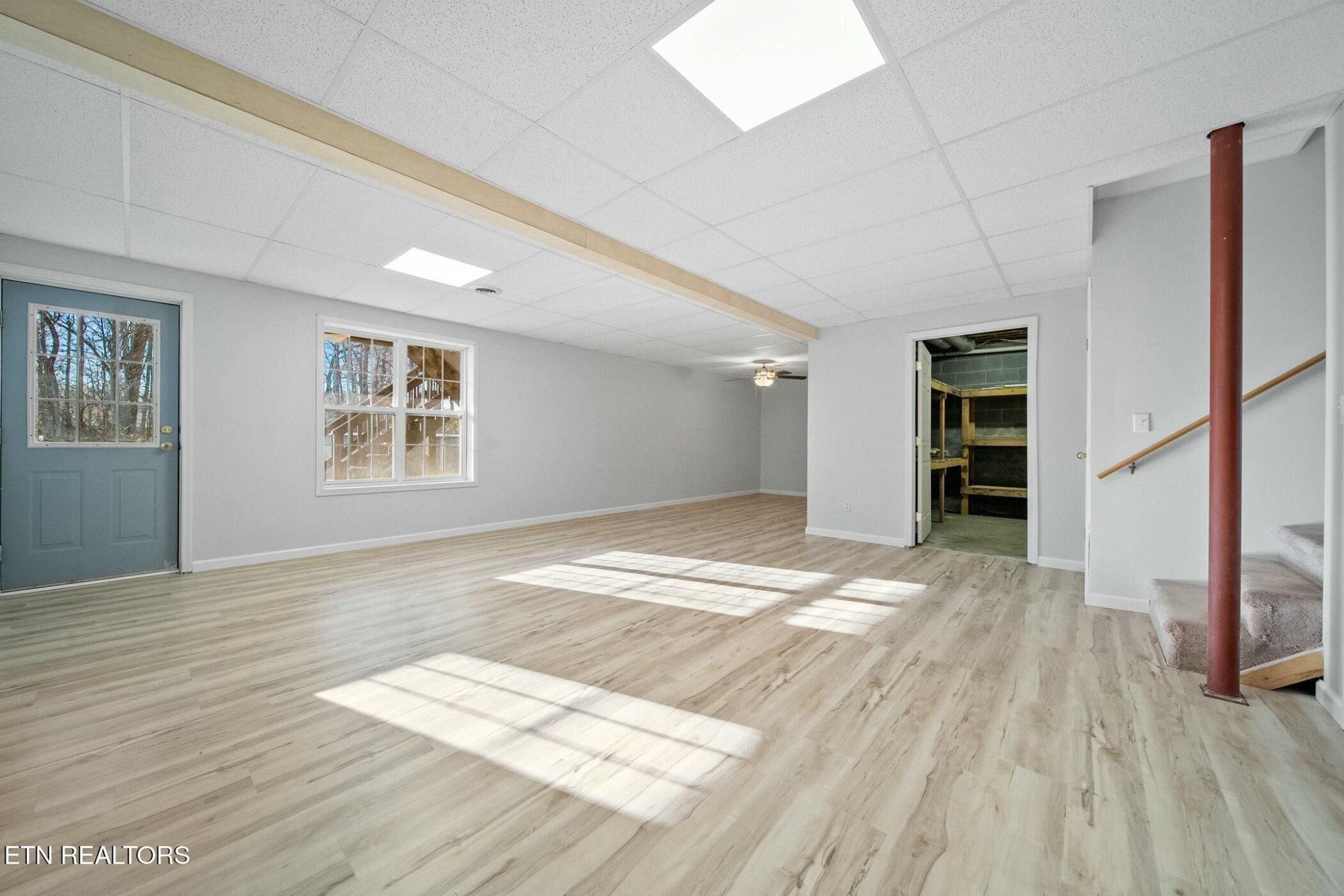 8345 Cliff Ridge Court Corryton, TN 37721 - Photo 34 of 54 a view of empty room with wooden floor and fan