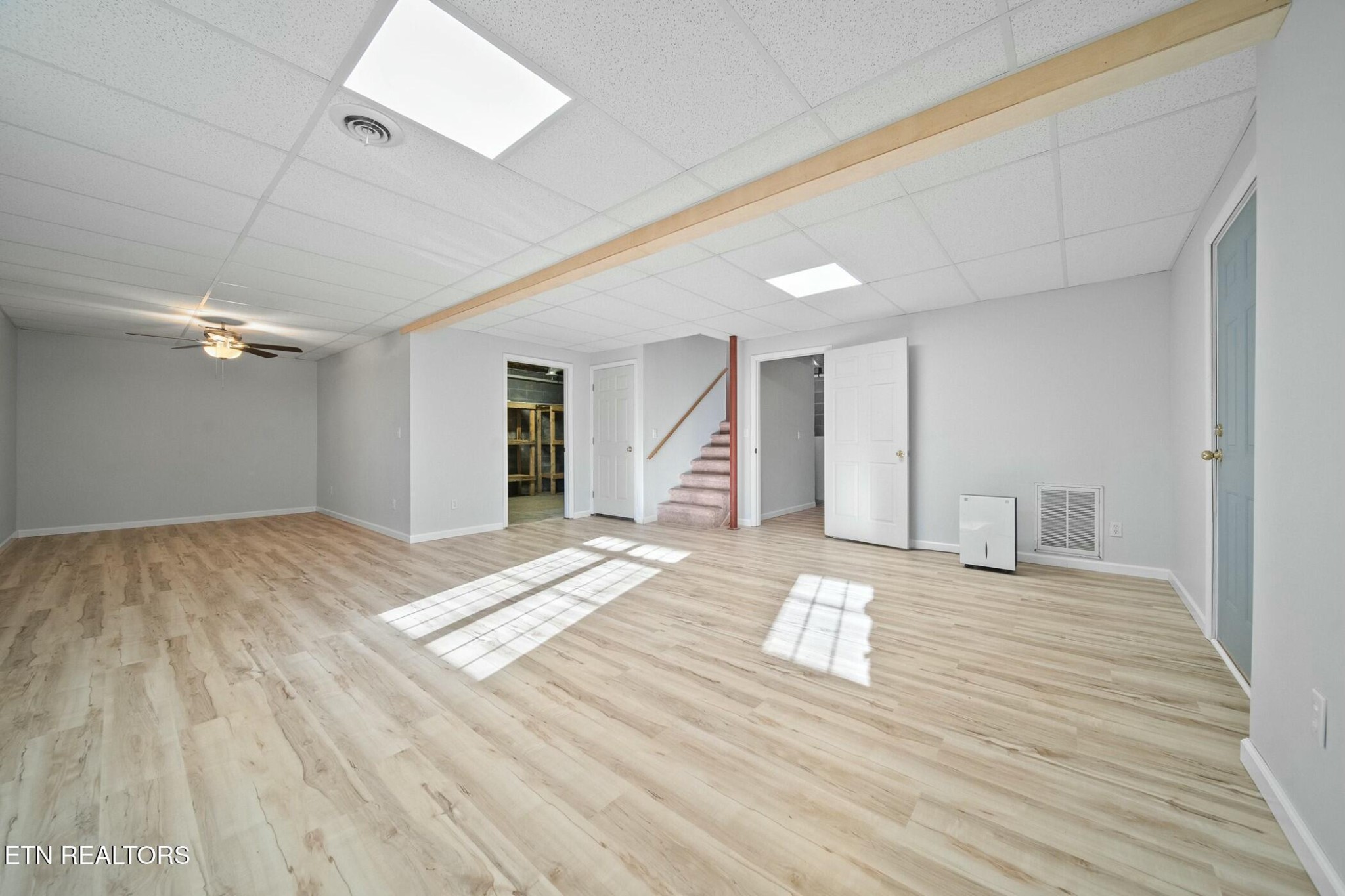 8345 Cliff Ridge Court Corryton, TN 37721 - Photo 35 of 54 a view of an empty room with wooden floor and a window
