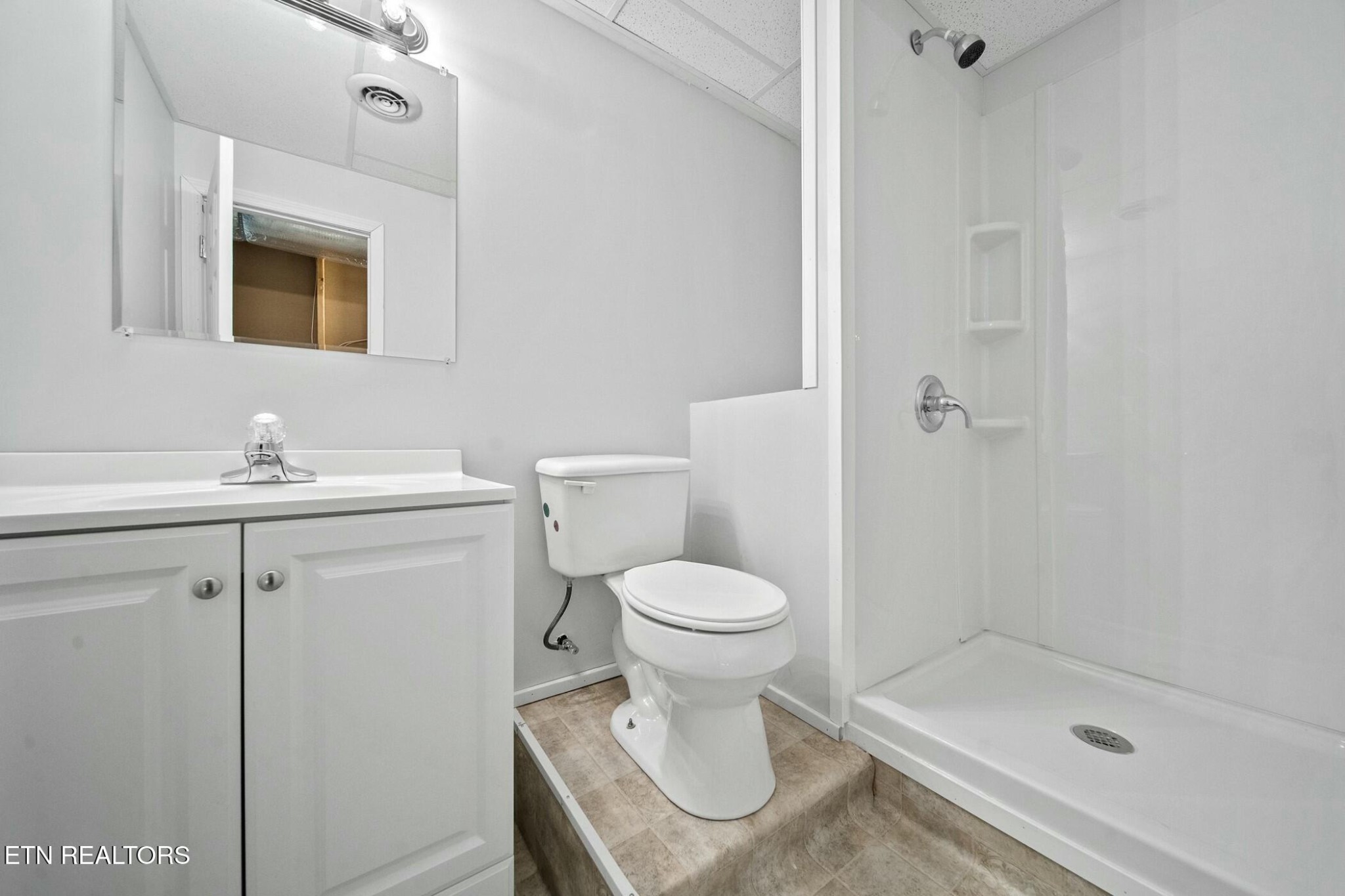 8345 Cliff Ridge Court Corryton, TN 37721 - Photo 39 of 54 a bathroom with a sink toilet and shower