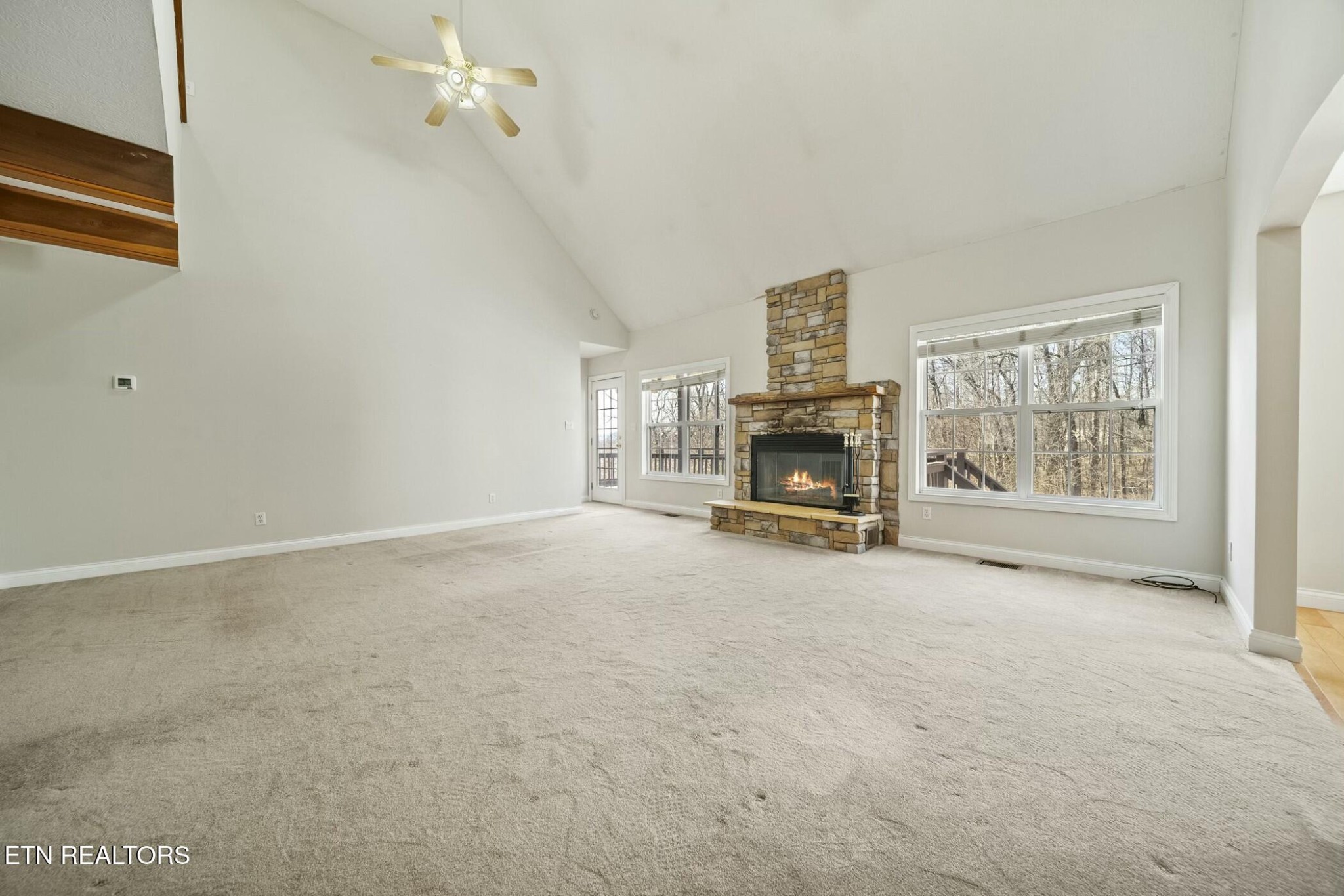 8345 Cliff Ridge Court Corryton, TN 37721 - Photo 9 of 54 an empty room with furniture and a fireplace