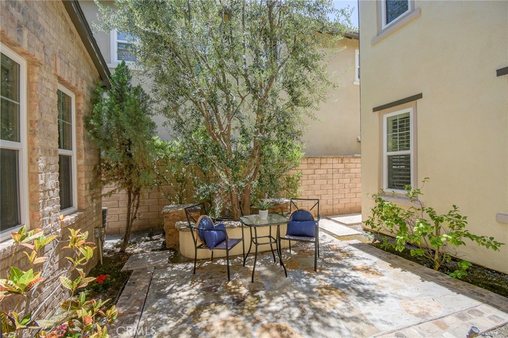 62 Gentry Irvine, CA 92620 - Photo 13 of 48 a view of a patio with table and chairs and potted plants