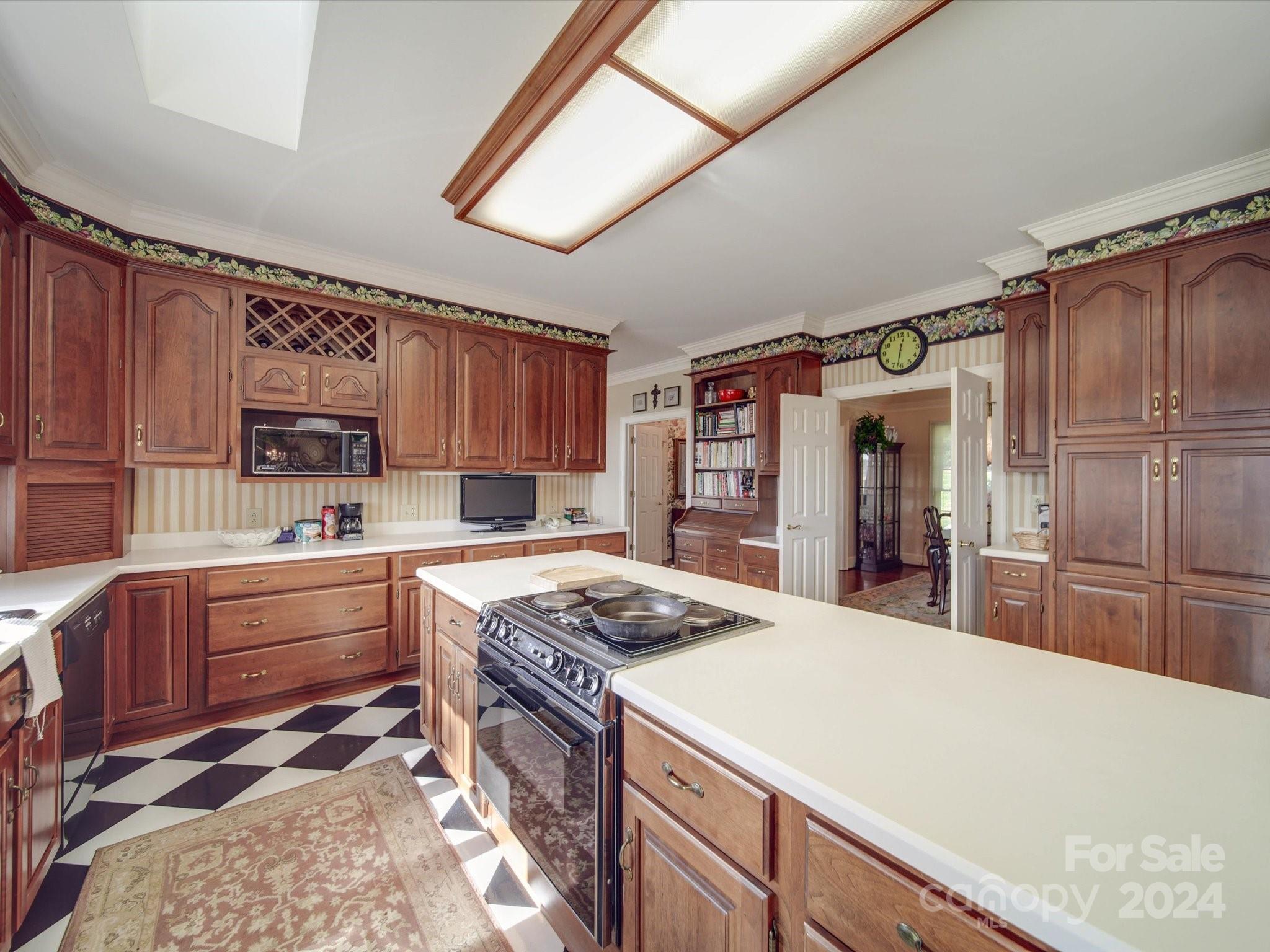 205 James Road Oakboro, NC 28129 - Photo 11 of 48 a kitchen with granite countertop a sink stove and cabinets