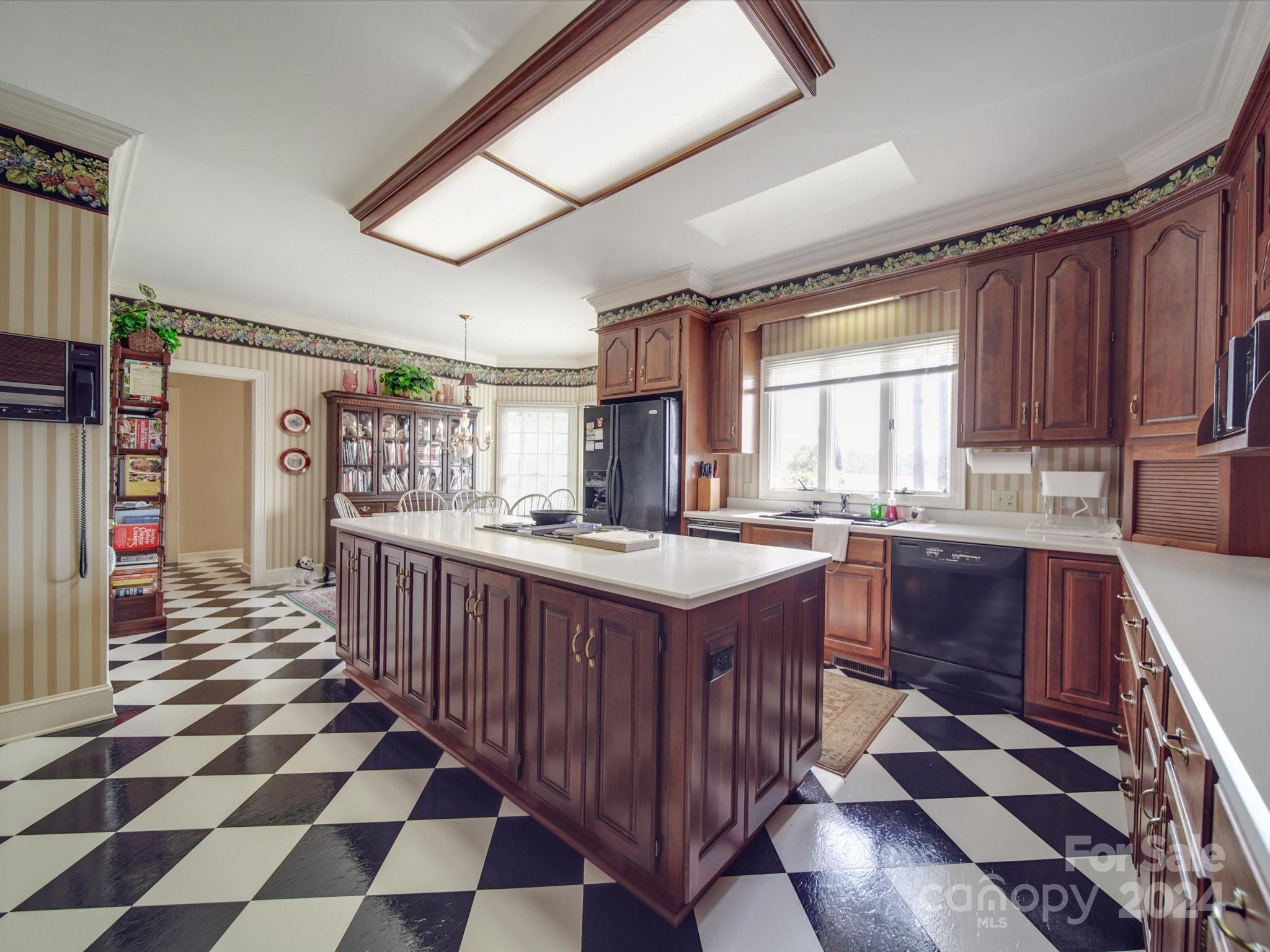 205 James Road Oakboro, NC 28129 - Photo 12 of 48 a kitchen with stainless steel appliances granite countertop a sink and cabinets