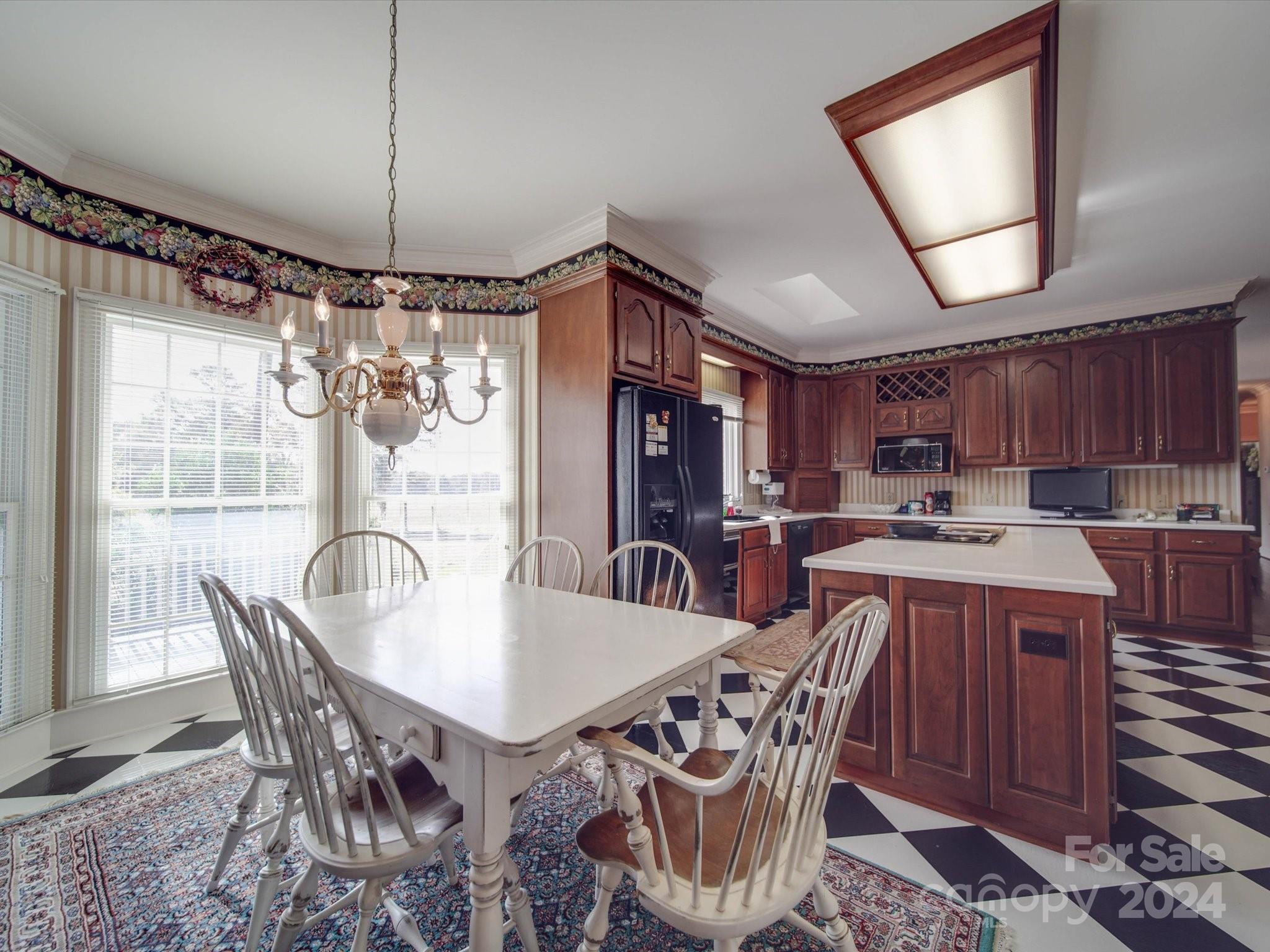 205 James Road Oakboro, NC 28129 - Photo 13 of 48 a dining room with furniture a chandelier and window