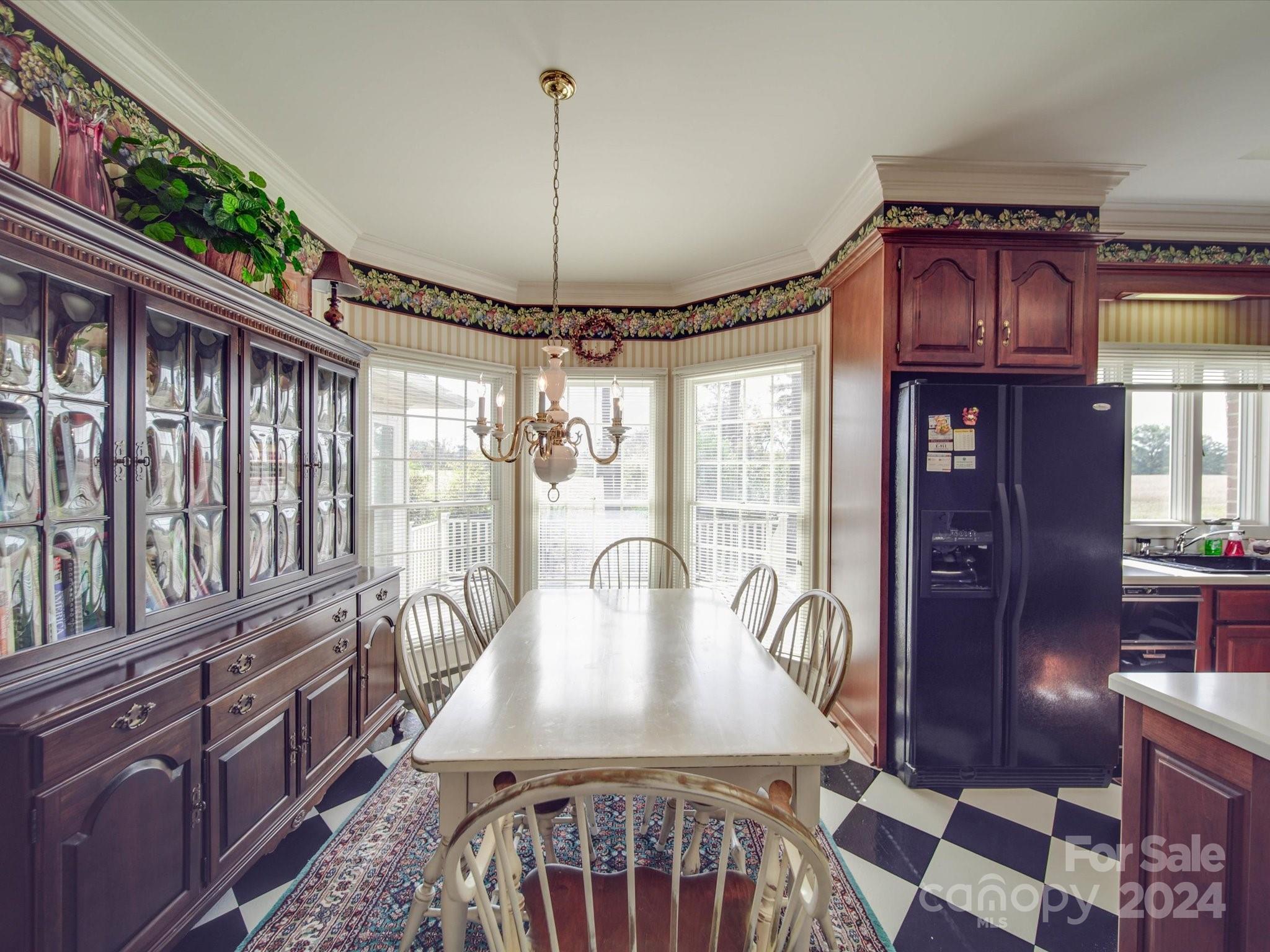 205 James Road Oakboro, NC 28129 - Photo 14 of 48 a view of a dining room with furniture window and wooden floor