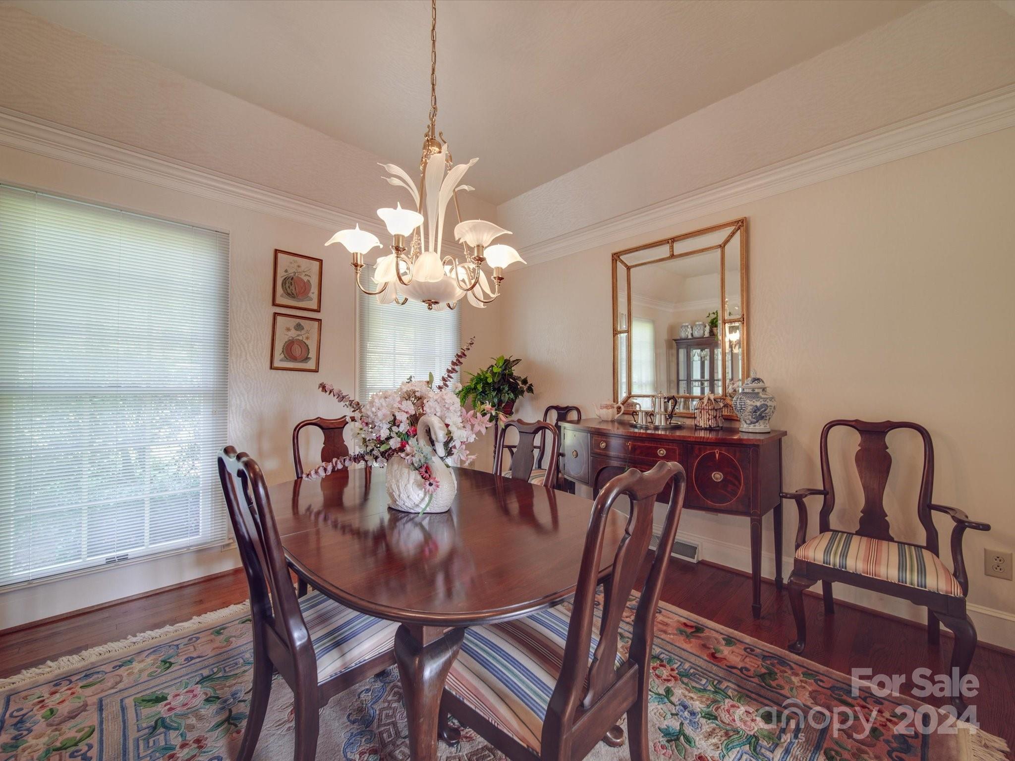 205 James Road Oakboro, NC 28129 - Photo 16 of 48 a view of a dining room with furniture and chandelier