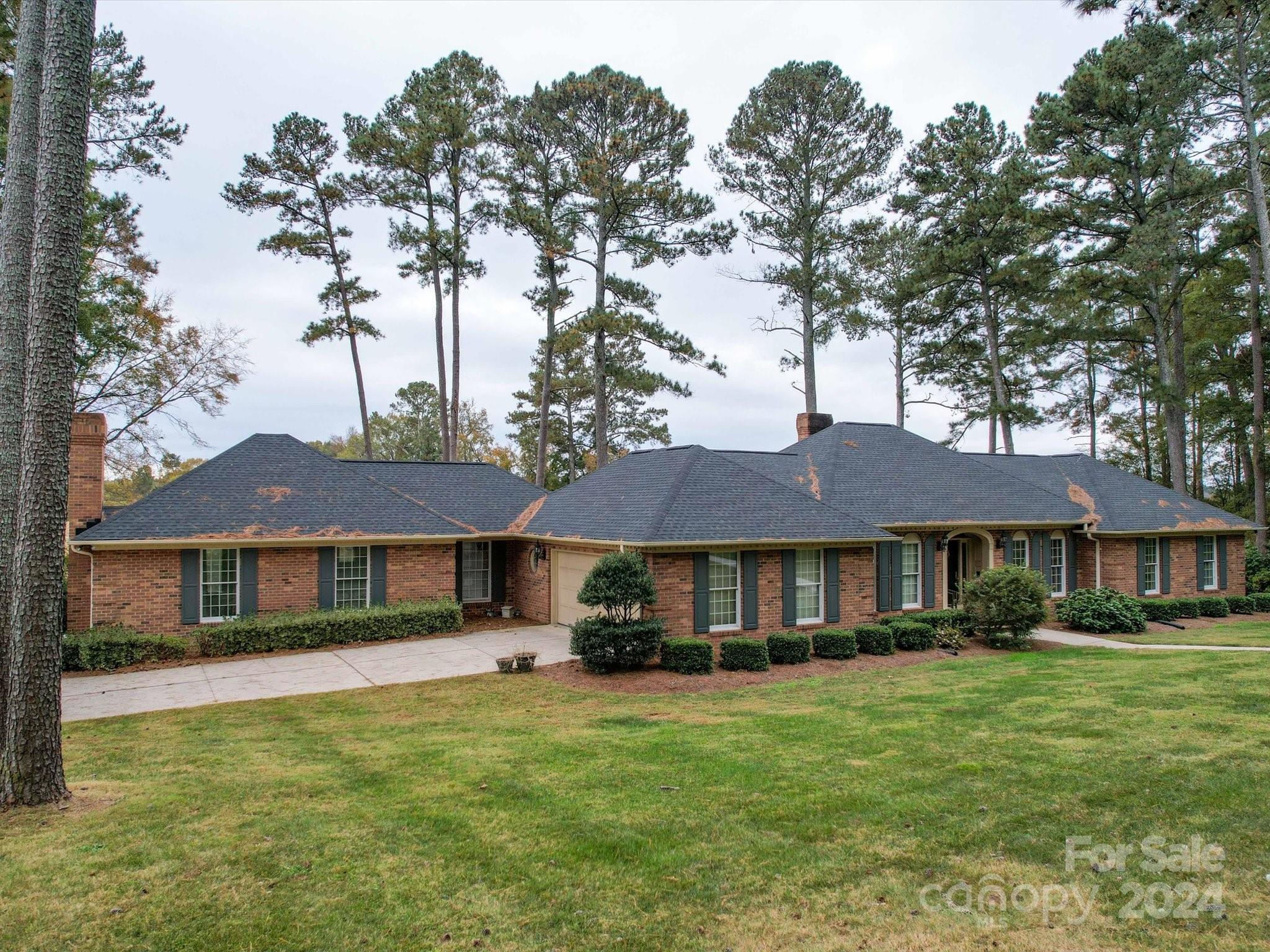 205 James Road Oakboro, NC 28129 - Photo 2 of 48 a front view of a house with a garden