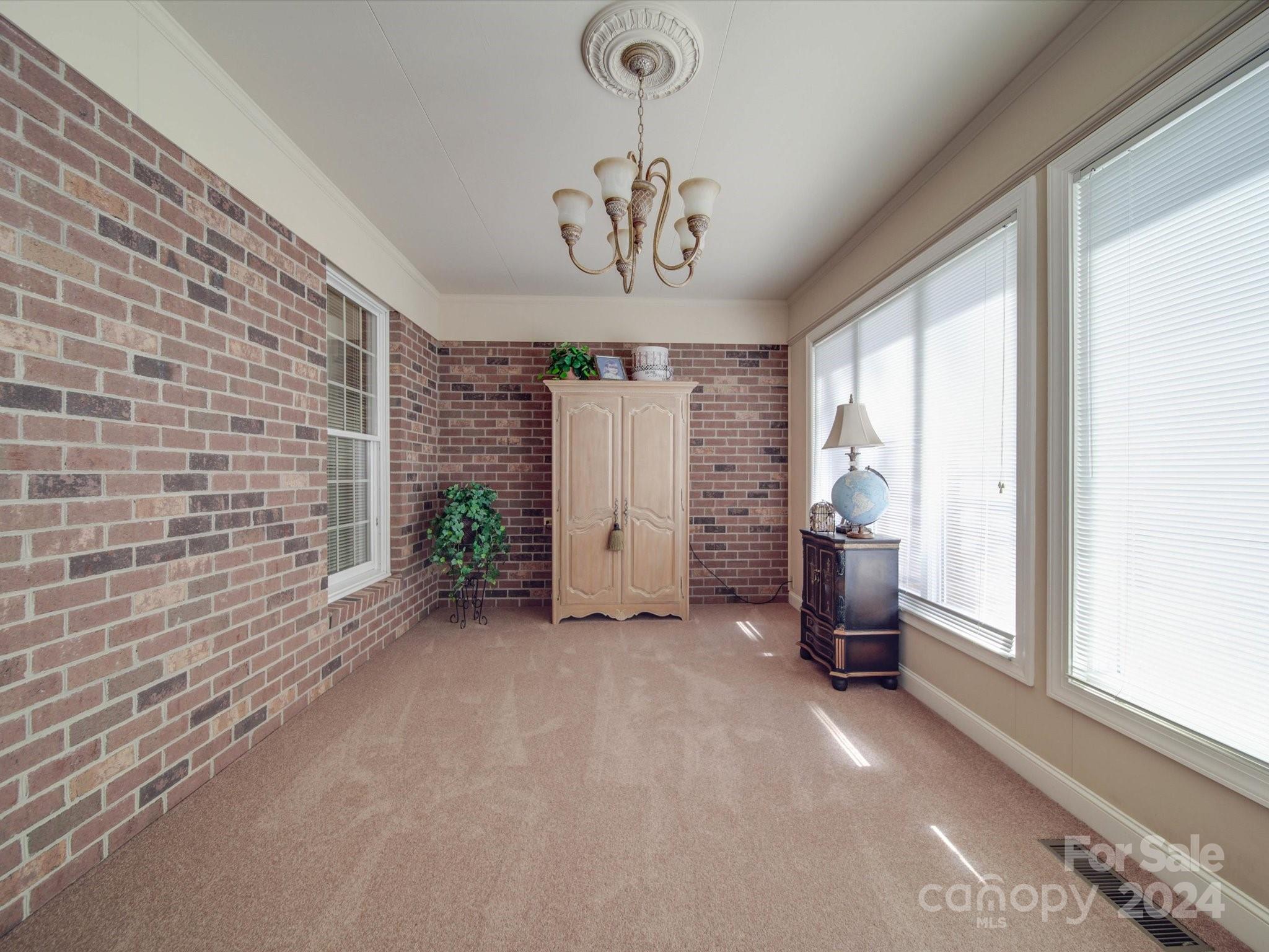 205 James Road Oakboro, NC 28129 - Photo 22 of 48 a view of a livingroom with a chandelier