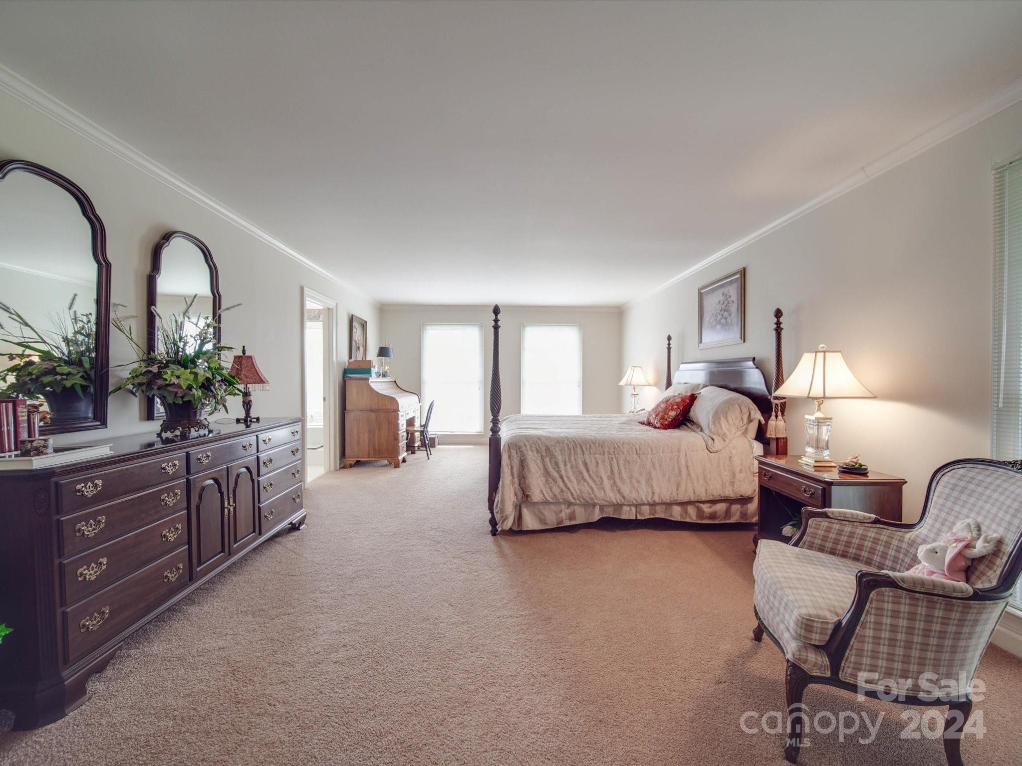205 James Road Oakboro, NC 28129 - Photo 26 of 48 a living room with furniture a lamp and a chandelier
